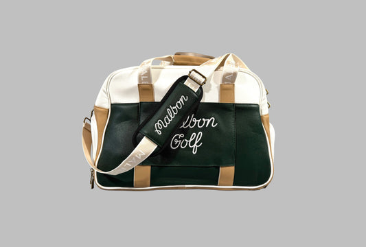 Green and beige duffel bag with 'Salomon' branding on a gray background