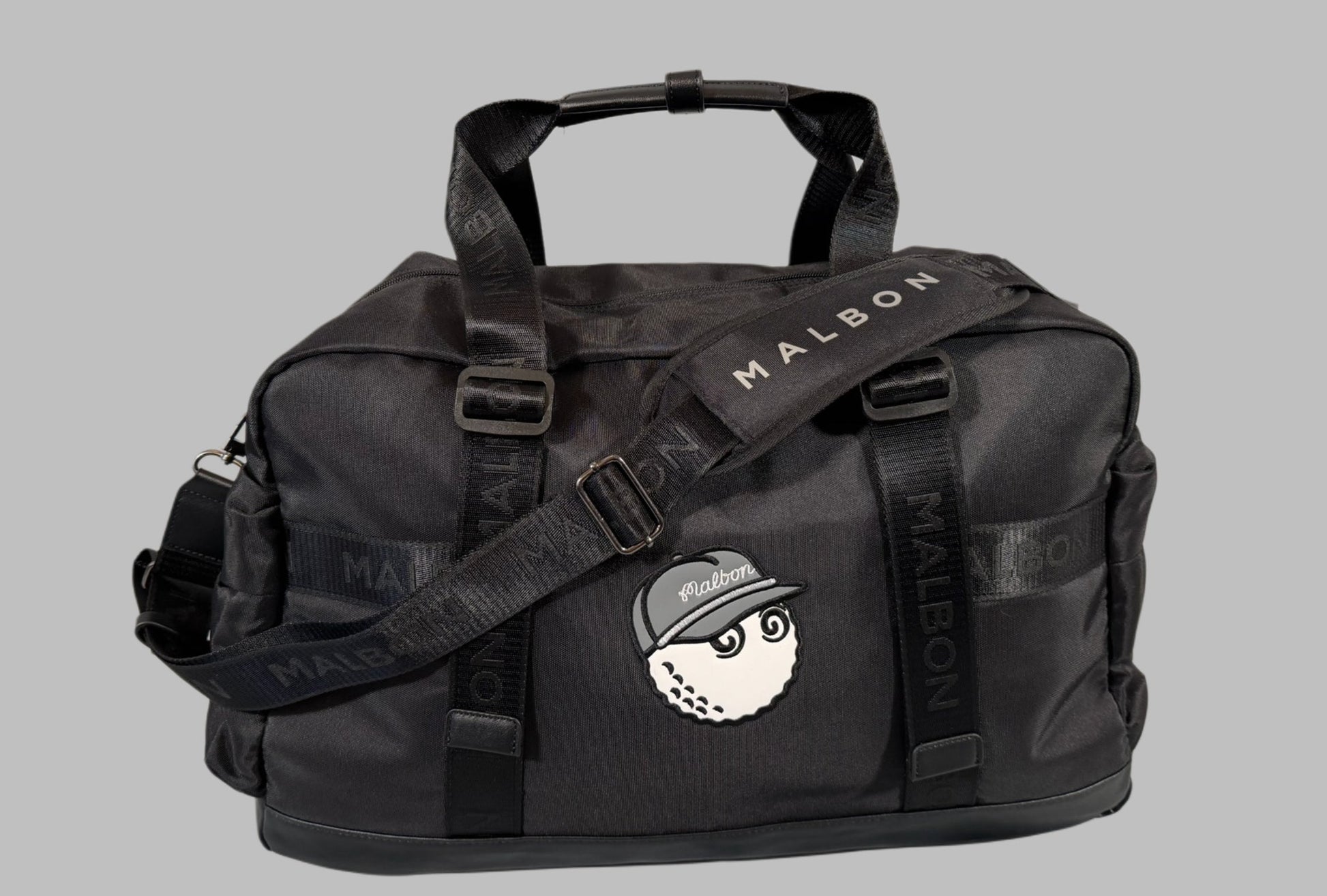 Black duffel bag with a logo on a gray background